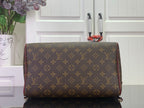 Monogram duffel-style bag with burgundy piping and gold hardware