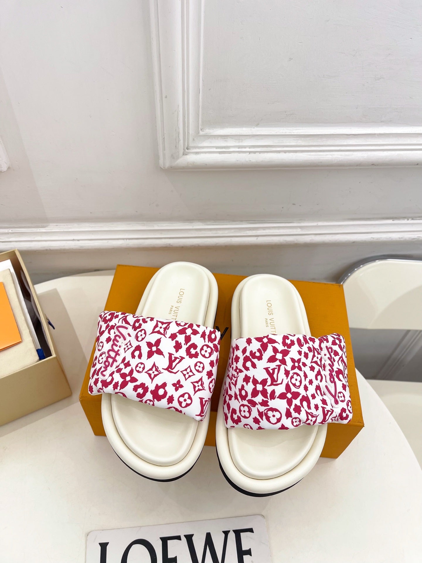 Louis Vuitton slide sandals with white straps and red monogram print