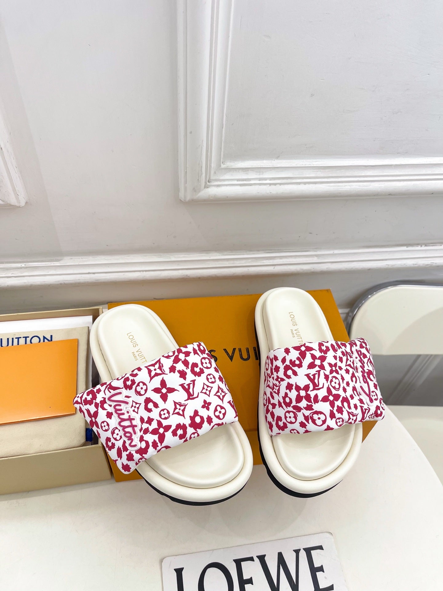 Louis Vuitton slide sandals, white with red patterned uppers and cushioned footbed