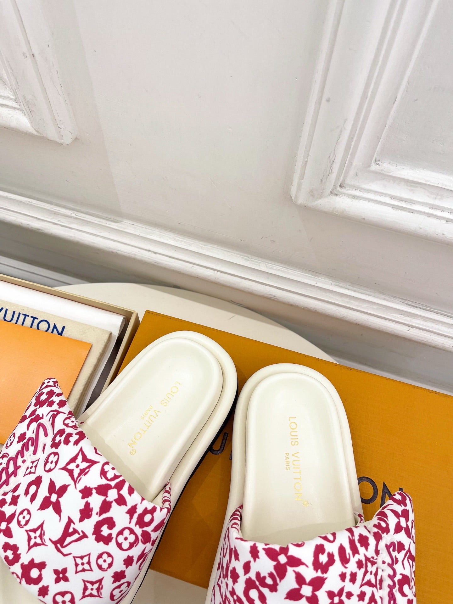Louis Vuitton slide sandals, white footbeds with red monogram patterned uppers