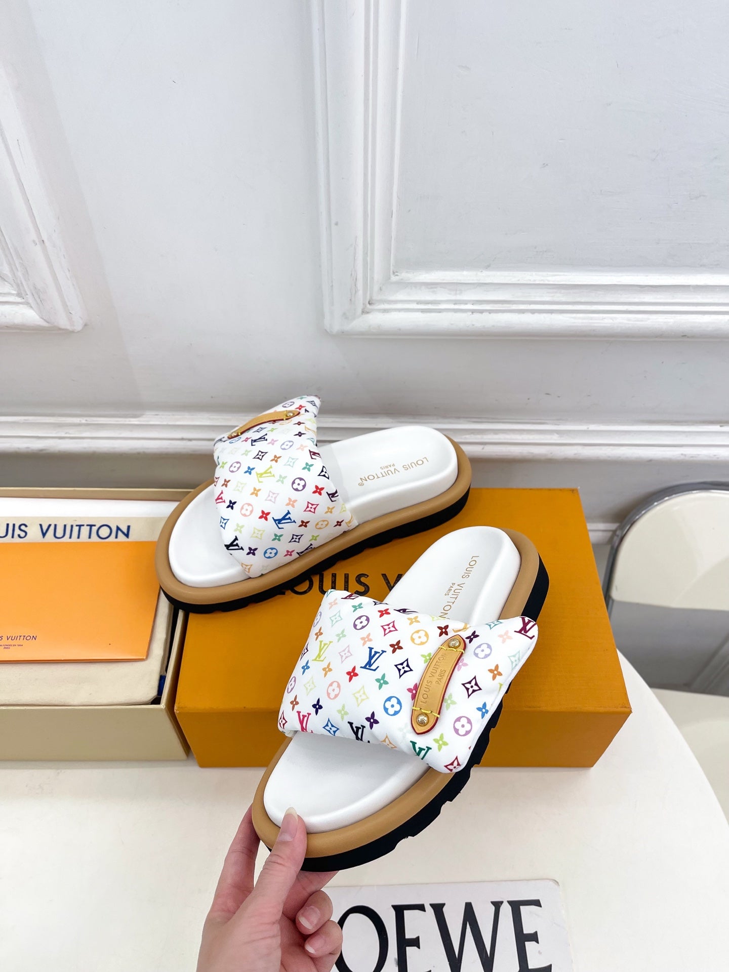 Logo slide sandals, white strap with multicolor monogram pattern and tan outsole