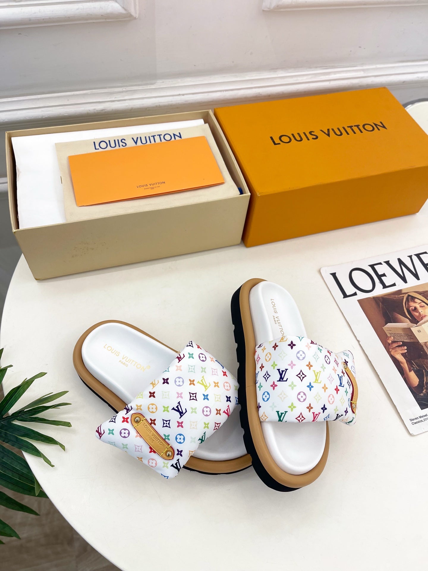 Logo slide sandals with white straps, multicolor monogram pattern, tan rubber sole