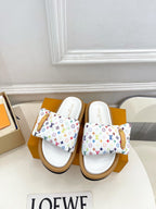 Logo slide sandals with white footbed, multicolor monogram straps, tan rubber sole