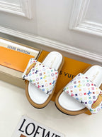 Logo slide sandals, pair view with white straps and multicolor monogram pattern
