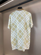 Short-sleeve polo shirt back view with yellow-and-white lattice check pattern