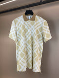 Short-sleeve polo shirt with yellow and white check pattern, buttoned placket