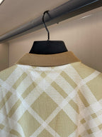 Polo shirt back with high collar and yellow-and-white grid check pattern