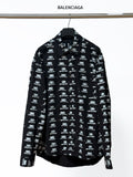 Black long-sleeve shirt with Balenciaga logo repeat, button-up collar.