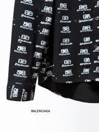 Black long-sleeve shirt with Balenciaga logo repeat, hem and sleeve detail.