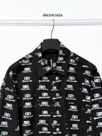 Black long-sleeve button-up shirt with Balenciaga logo repeat, full front view.