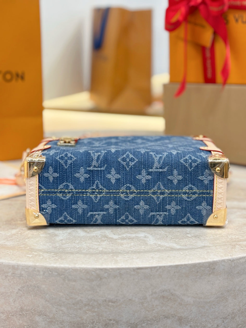 Louis Vuitton bag blue monogram canvas with gold hardware, top side view