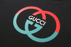 Black Gucci logo T-shirt with red and teal graphic close-up