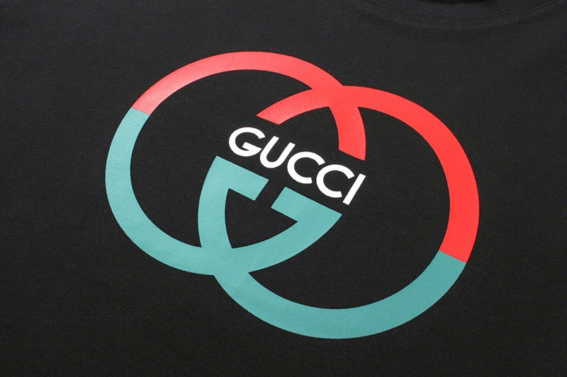 Black Gucci logo T-shirt with red and teal graphic close-up