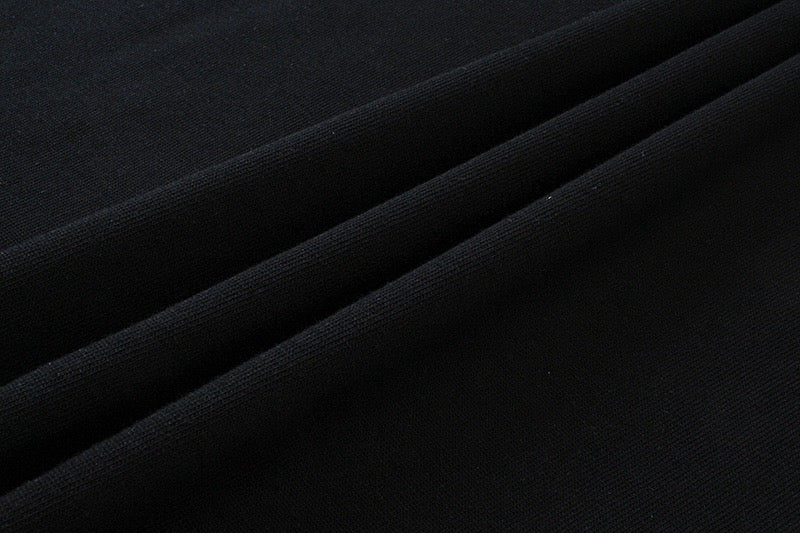 Black T-shirt fabric close-up with smooth knit texture
