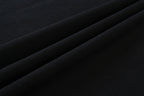 Black T-shirt fabric close-up with smooth knit texture
