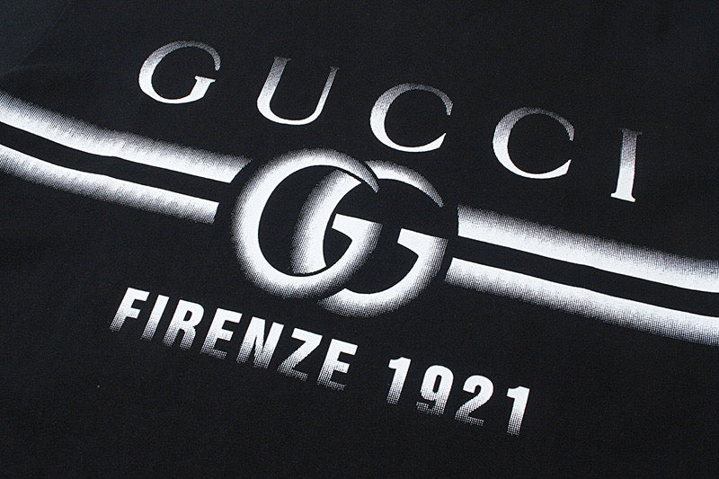 Black short-sleeve T-shirt with Gucci "Firenze 1921" logo graphic close-up