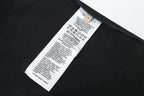 Black T-shirt interior with white Gucci size and care label