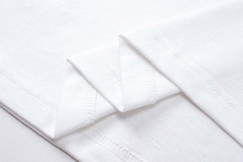 White T-shirt sleeve cuff and folded fabric detail