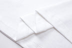 White T-shirt sleeve cuff and folded fabric detail