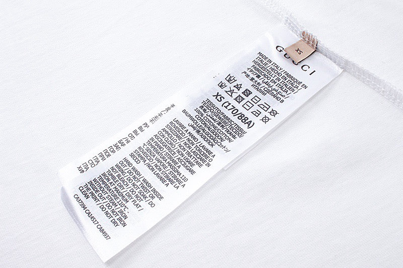 White T-shirt interior neck label with care and size text