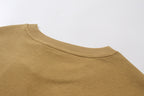 Tan crew-neck T-shirt with ribbed collar close-up