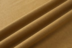 Tan T-shirt fabric close-up showing fine texture