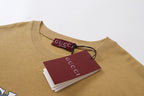 Tan crew-neck T-shirt with Gucci label and hang tag at collar