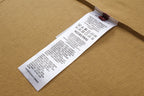 Tan T-shirt inside care label tag near collar