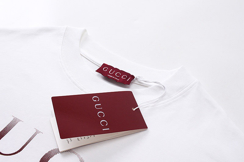 White Gucci T-shirt neckline with Gucci tag and attached hang tag