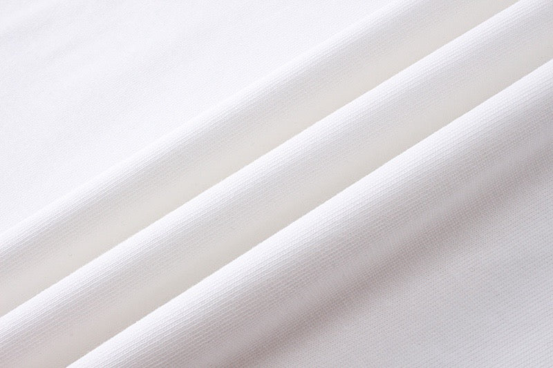 White T-shirt fabric close-up showing smooth knit texture