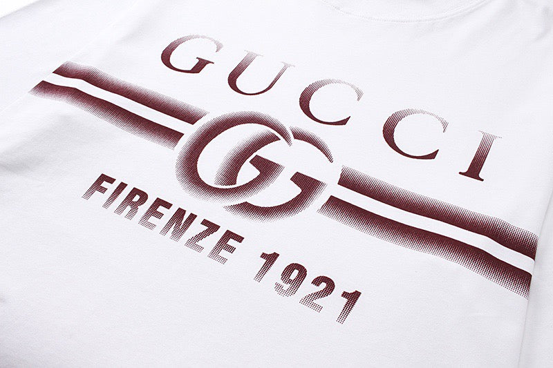 White Gucci T-shirt detail: GUCCI Firenze 1921 graphic across chest