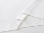 White T-shirt hem with double-stitched seam detail
