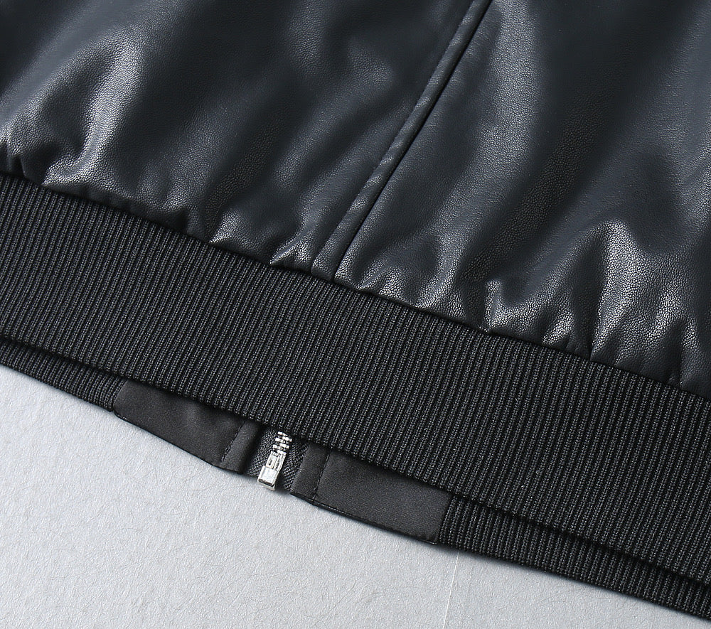 Black leather jacket ribbed waistband hem and zipper seam