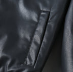 Black leather jacket sleeve seam with narrow vertical panel