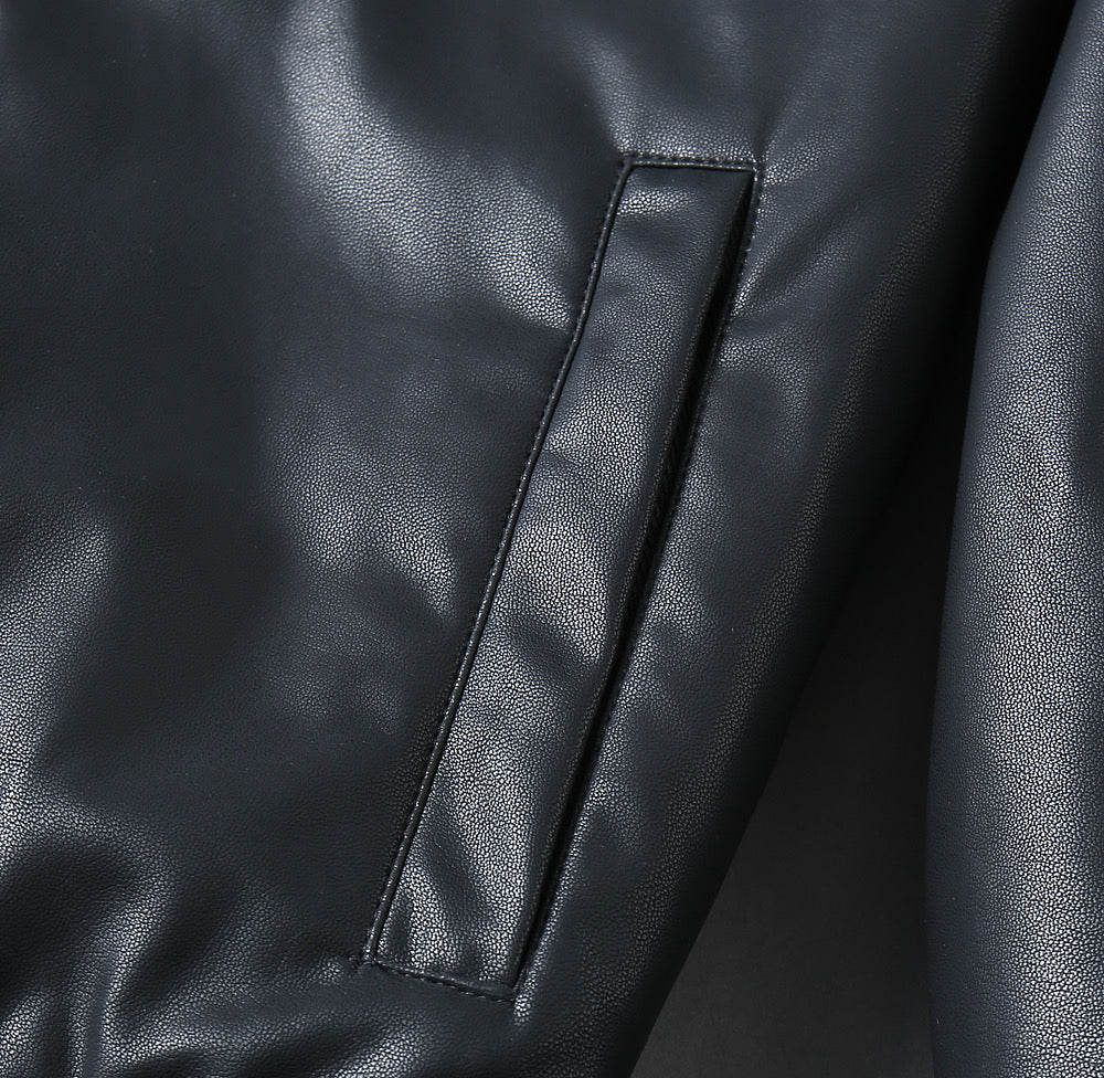 Black leather jacket sleeve seam with narrow vertical panel