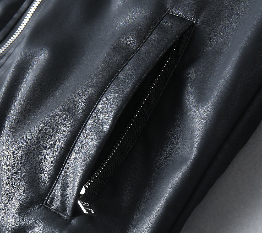 Black leather jacket sleeve lining seam and stitched panel