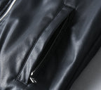 Black leather jacket sleeve lining seam and stitched panel