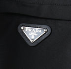Prada logo patch on dark jacket chest pocket
