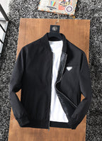 Black zip-up jacket with stand collar, front zipper, and logo chest patch