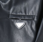Black leather jacket chest pocket with triangular logo patch