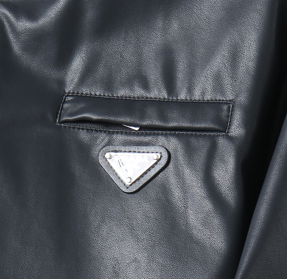 Black leather jacket chest pocket with triangular logo patch
