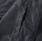Prada black jacket fabric close-up with zipper track and side seam