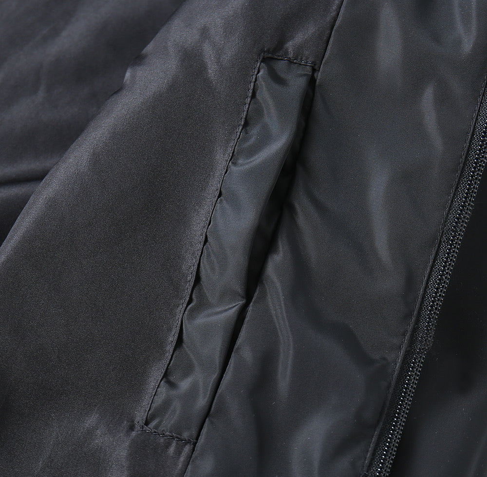 Prada black jacket fabric close-up with zipper track and side seam