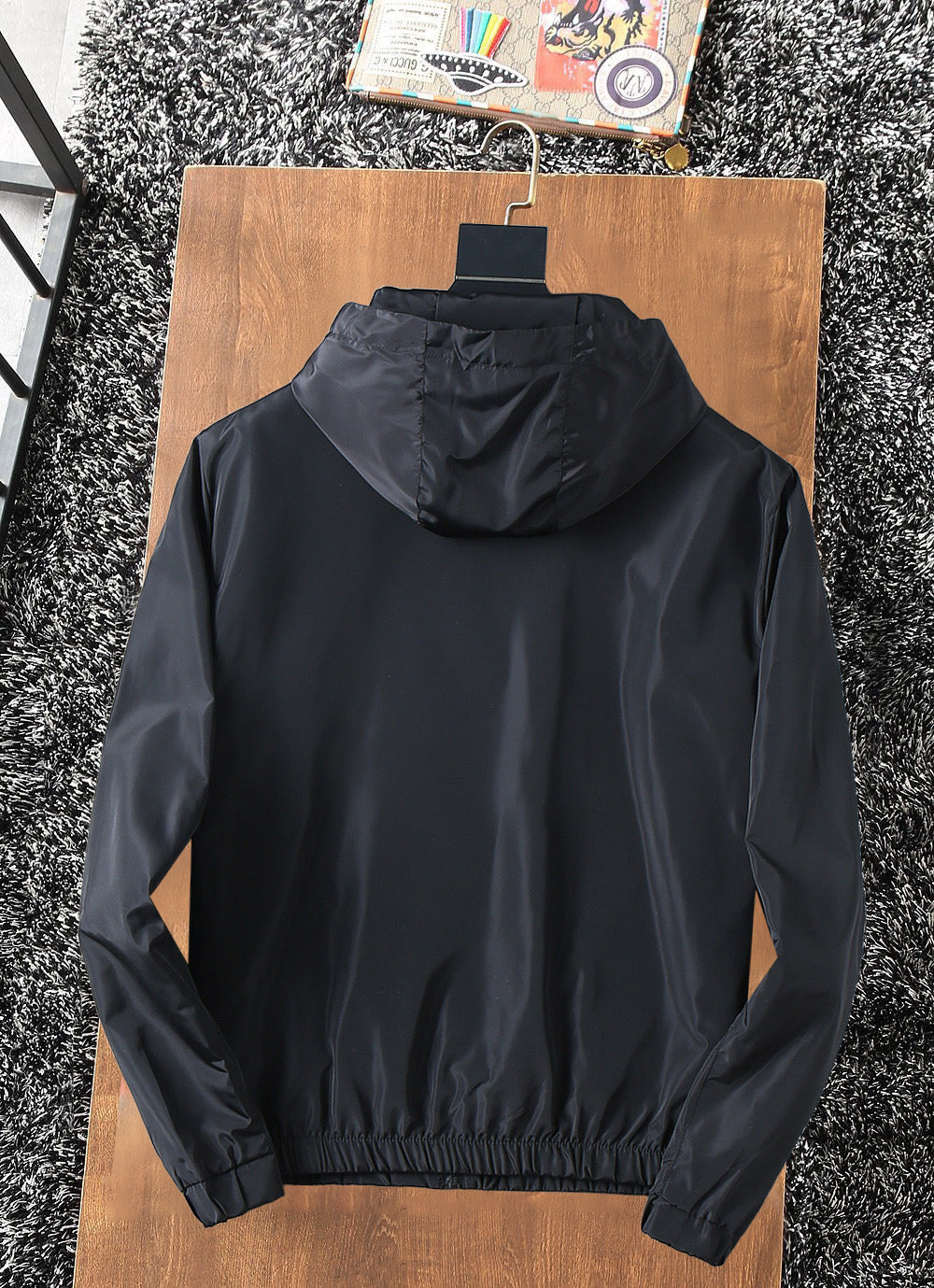 Prada long hooded jacket back view, black with drawstring hood