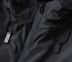 Prada black zip jacket close-up with drawstring pull tags