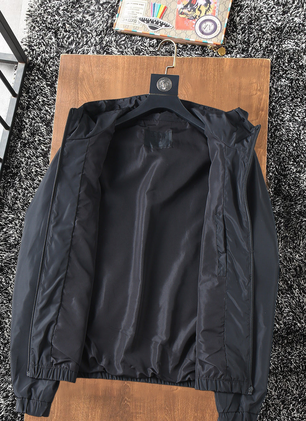 Prada long hooded jacket interior view, black lining and hood opening