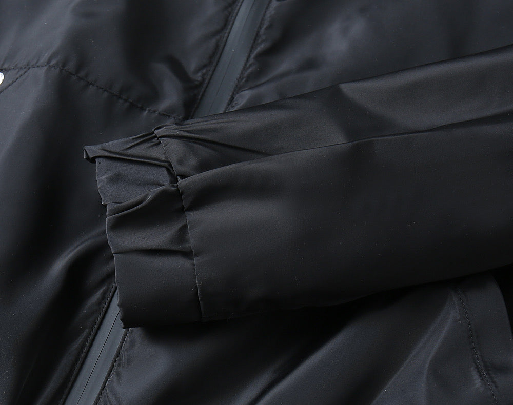 Prada long jacket sleeve seam with stitched panel and snap detail