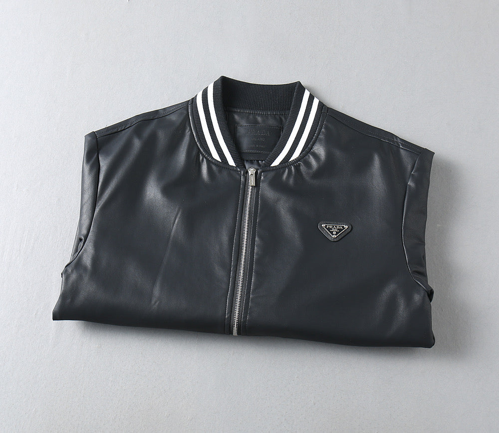 Black leather jacket with front zipper, striped rib collar, and triangular logo patch