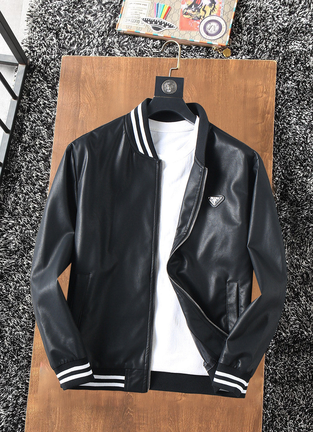 Prada leather jacket in dark color with striped ribbed collar and zip front