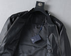 Black leather jacket with front zipper and interior label tag